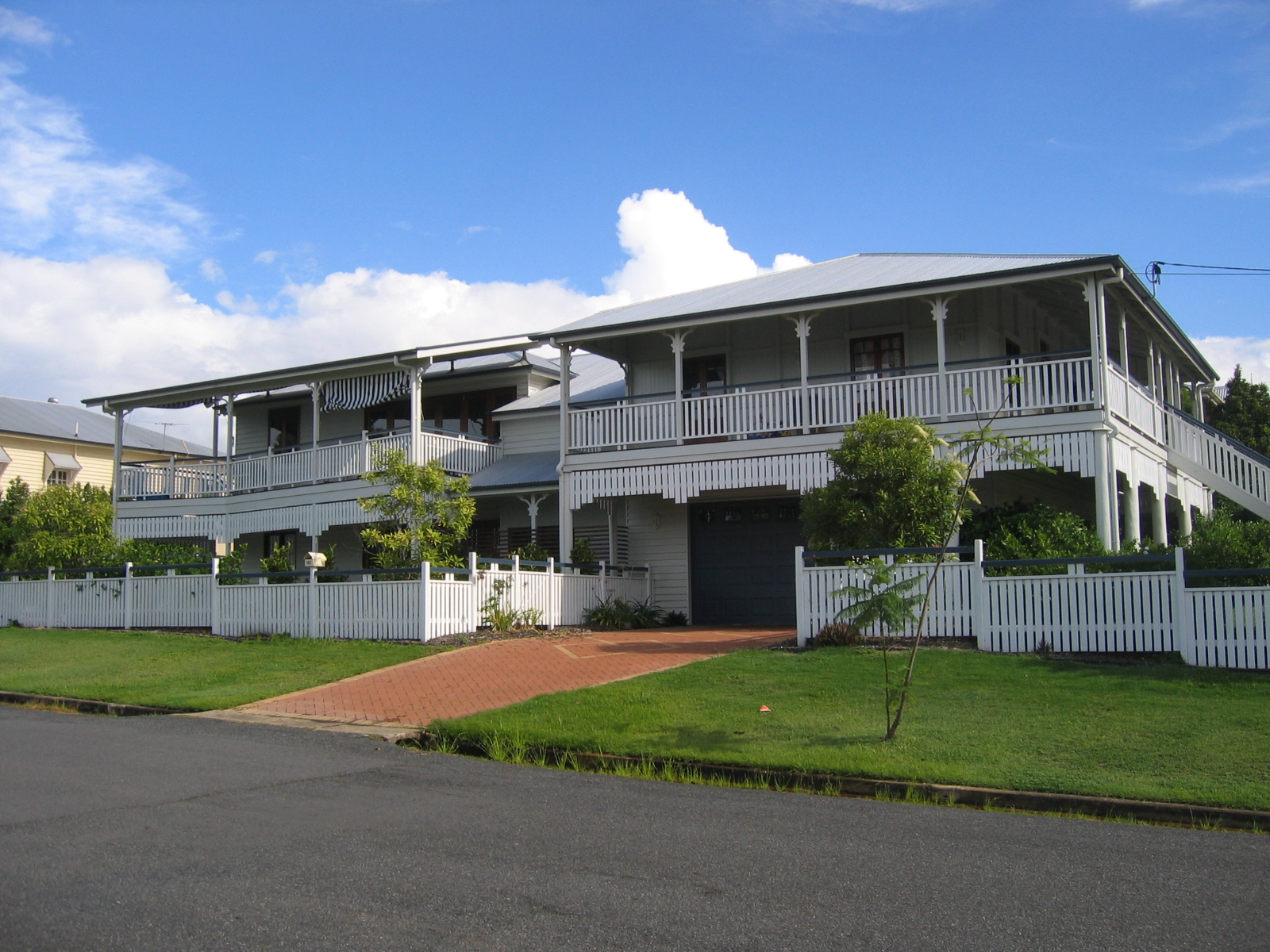 Queenslander house in Brisbane with a raised veranda and surrounding trees